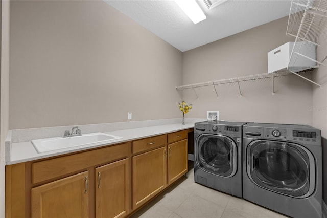 16086 Johns Lake Overlook Dr, Winter Garden, FL 34787 - laundry area with washer and dryer, light tile patterned floors, and cabinet space