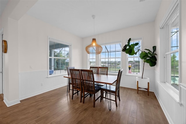 16086 Johns Lake Overlook Dr, Winter Garden, FL 34787 - dining room with wainscoting, dark wood finished floors, and plenty of natural light