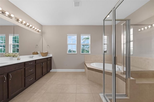 16086 Johns Lake Overlook Dr, Winter Garden, FL 34787 - full bath with double vanity, a bath, tile patterned floors, and a stall shower
