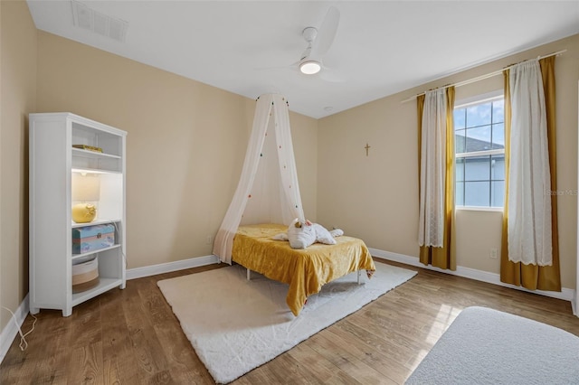 16086 Johns Lake Overlook Dr, Winter Garden, FL 34787 - bedroom featuring wood finished floors, baseboards, and a ceiling fan