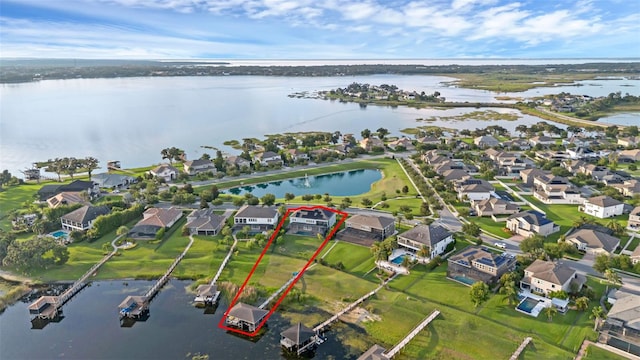 16086 Johns Lake Overlook Dr, Winter Garden, FL 34787 - aerial view of property and surrounding area featuring nearby suburban area, property parcel outlined, and a large body of water