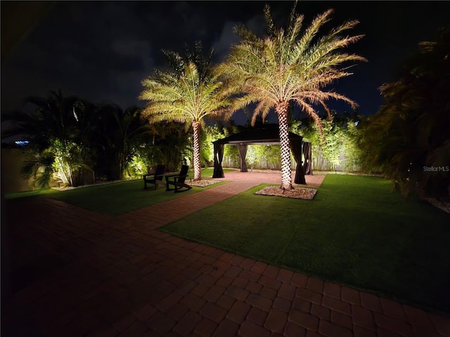 2227 Blue Salvia St, Clermont, FL 34711 - yard at twilight featuring a gazebo, a lawn, and a patio