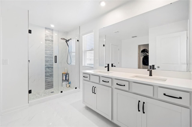 2227 Blue Salvia St, Clermont, FL 34711 - bathroom with a marble finish shower, double vanity, marble finish flooring, recessed lighting, and a spacious closet