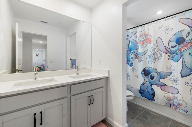 2227 Blue Salvia St, Clermont, FL 34711 - bathroom with double vanity, toilet, shower / bath combination with curtain, and baseboards