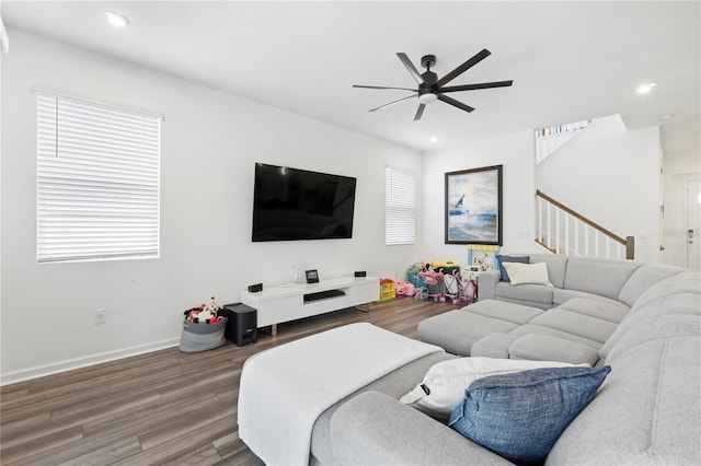 2227 Blue Salvia St, Clermont, FL 34711 - living room featuring wood finished floors, a ceiling fan, stairs, recessed lighting, and baseboards