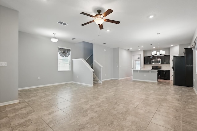 10172 Storey Grove Way, Winter Garden, FL 34787 - unfurnished living room with a ceiling fan, a chandelier, light tile patterned flooring, stairs, and recessed lighting