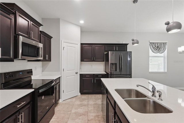10172 Storey Grove Way, Winter Garden, FL 34787 - kitchen with appliances with stainless steel finishes, a sink, tasteful backsplash, light countertops, and pendant lighting