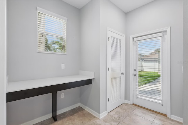 10172 Storey Grove Way, Winter Garden, FL 34787 - entryway with light tile patterned floors and baseboards