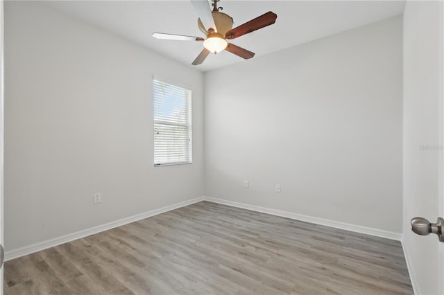 10172 Storey Grove Way, Winter Garden, FL 34787 - unfurnished room featuring wood finished floors, baseboards, and a ceiling fan