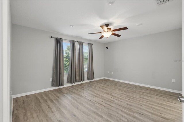 10172 Storey Grove Way, Winter Garden, FL 34787 - unfurnished room featuring a ceiling fan, wood finished floors, and baseboards