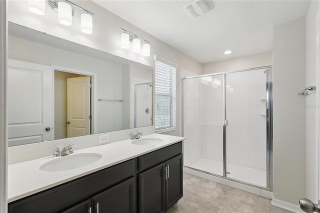 10172 Storey Grove Way, Winter Garden, FL 34787 - bathroom with a shower stall, double vanity, and tile patterned floors
