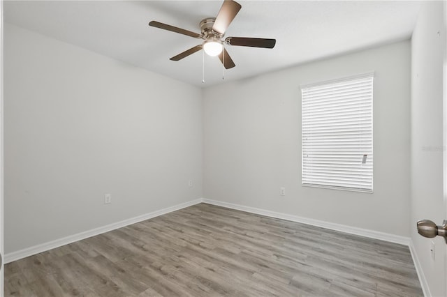 10172 Storey Grove Way, Winter Garden, FL 34787 - unfurnished room with wood finished floors, baseboards, and a ceiling fan