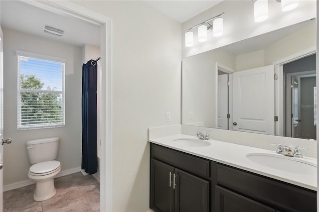 10172 Storey Grove Way, Winter Garden, FL 34787 - bathroom featuring double vanity, toilet, baseboards, curtained shower, and tile patterned floors