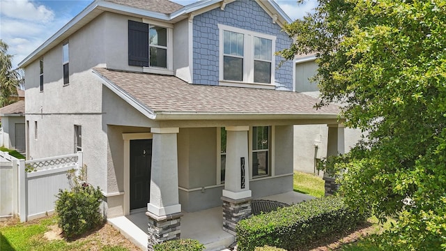 10172 Storey Grove Way, Winter Garden, FL 34787 - view of front of property featuring roof with shingles, stucco siding, and a porch