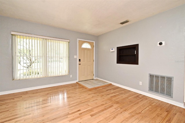 2810 Nancy St, Orlando, FL 32806 - foyer with wood finished floors and baseboards