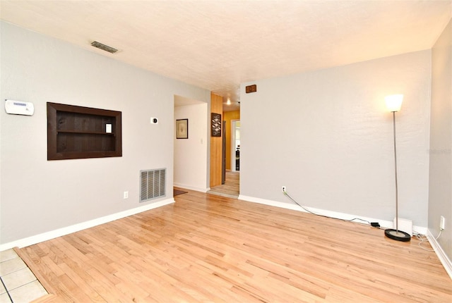 2810 Nancy St, Orlando, FL 32806 - empty room featuring light wood finished floors and baseboards