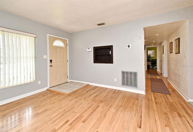 2810 Nancy St, Orlando, FL 32806 - foyer featuring wood finished floors and baseboards