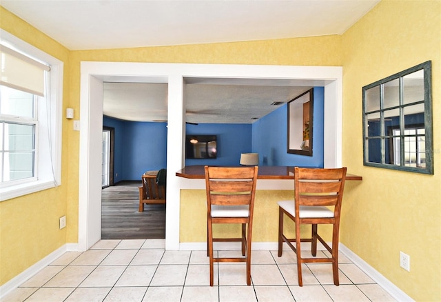 2810 Nancy St, Orlando, FL 32806 - kitchen with tile patterned flooring and baseboards