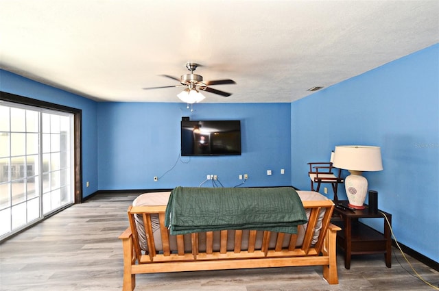 2810 Nancy St, Orlando, FL 32806 - living area with baseboards, ceiling fan, and wood finished floors