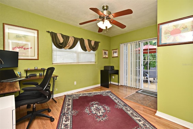 2810 Nancy St, Orlando, FL 32806 - office space featuring wood finished floors, a ceiling fan, and baseboards