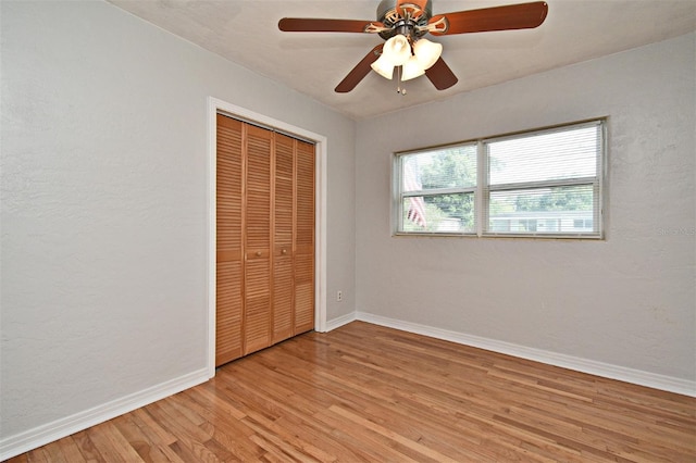 2810 Nancy St, Orlando, FL 32806 - unfurnished bedroom featuring light wood-style floors, baseboards, a closet, and ceiling fan