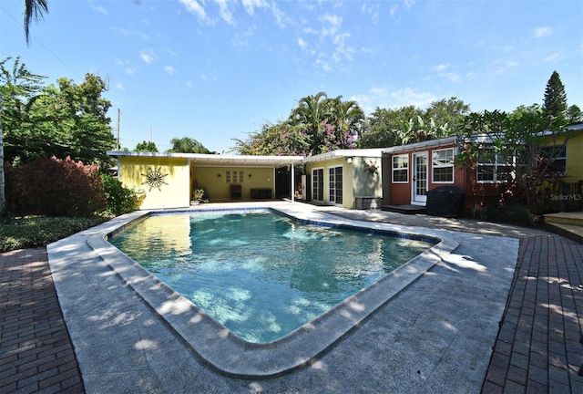 2810 Nancy St, Orlando, FL 32806 - outdoor pool featuring a patio and french doors