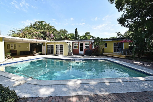 2810 Nancy St, Orlando, FL 32806 - outdoor pool featuring a deck, french doors, and a patio