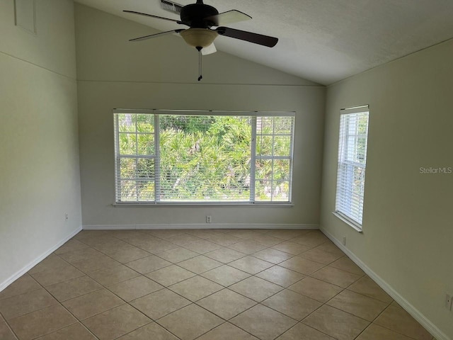 2143 Autumn View Dr, Orlando, FL 32825 - unfurnished room with vaulted ceiling, light tile patterned floors, ceiling fan, and baseboards