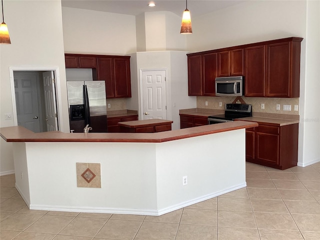 2143 Autumn View Dr, Orlando, FL 32825 - kitchen with appliances with stainless steel finishes, a large island, light tile patterned flooring, tasteful backsplash, and a high ceiling