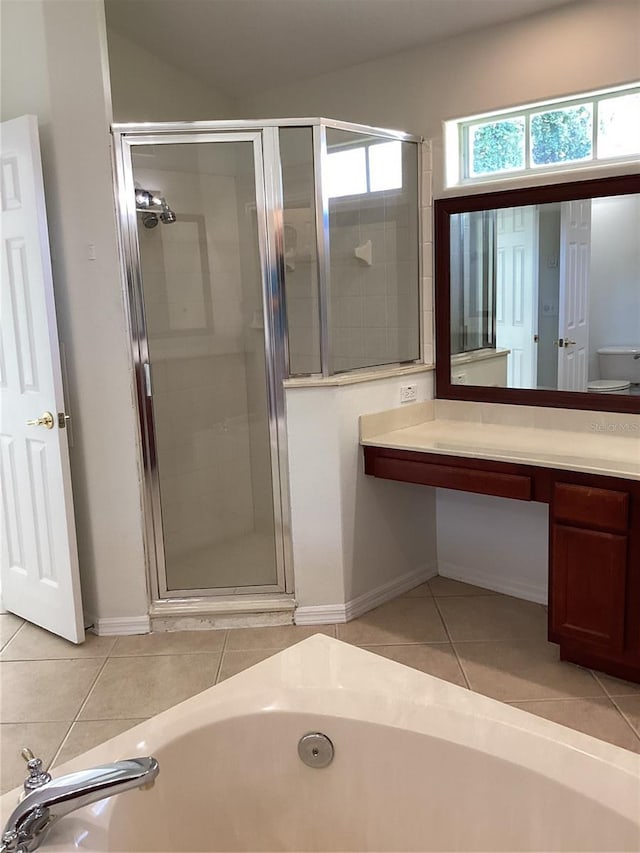 2143 Autumn View Dr, Orlando, FL 32825 - bathroom featuring a tub with jets, a shower stall, vanity, and tile patterned flooring