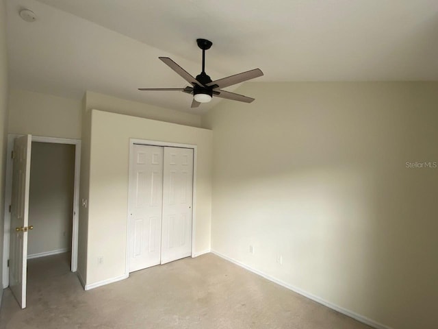 2143 Autumn View Dr, Orlando, FL 32825 - unfurnished bedroom featuring baseboards, carpet, a closet, a ceiling fan, and vaulted ceiling
