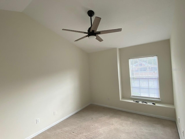 2143 Autumn View Dr, Orlando, FL 32825 - spare room featuring vaulted ceiling, a ceiling fan, carpet floors, and baseboards