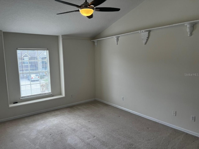 2143 Autumn View Dr, Orlando, FL 32825 - empty room with carpet, ceiling fan, lofted ceiling, a textured ceiling, and baseboards