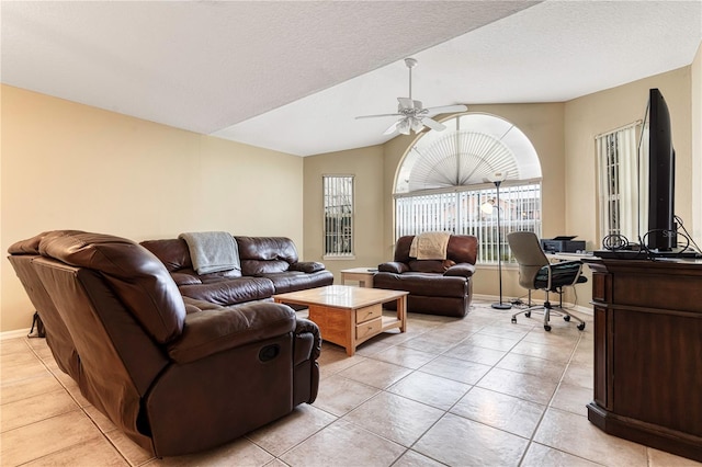 8719 Rockingham Ter Unit B, Kissimmee, FL 34747 - living room with a desk, a ceiling fan, light tile patterned flooring, baseboards, and vaulted ceiling