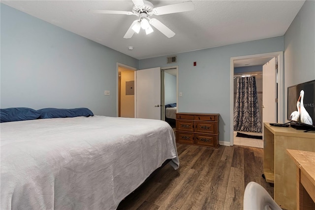 8719 Rockingham Ter Unit B, Kissimmee, FL 34747 - bedroom with wood finished floors, electric panel, a ceiling fan, baseboards, and connected bathroom