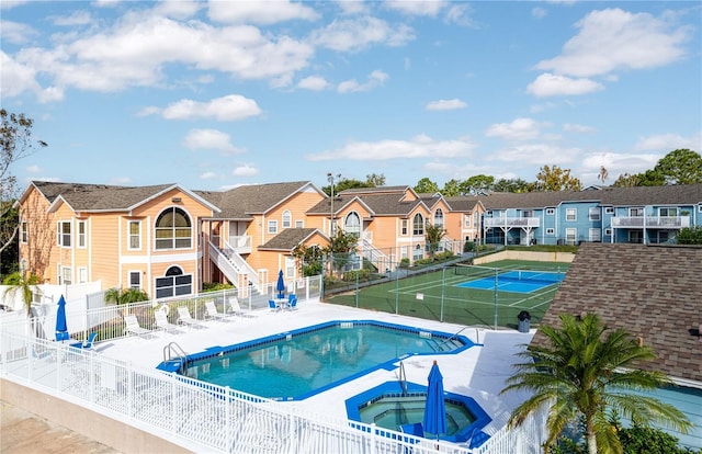 8719 Rockingham Ter Unit B, Kissimmee, FL 34747 - community pool with a community hot tub, a fenced backyard, and a residential view