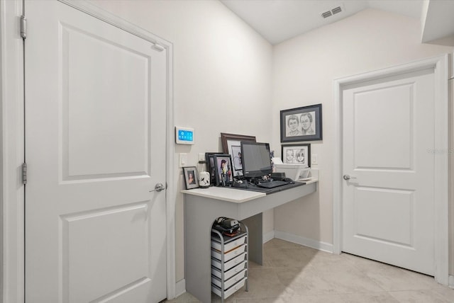 8811 Bally Neal Loop, Davenport, FL 33896 - home office featuring baseboards, light tile patterned floors, and vaulted ceiling