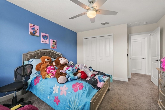 8811 Bally Neal Loop, Davenport, FL 33896 - bedroom featuring carpet flooring, a closet, baseboards, and a ceiling fan