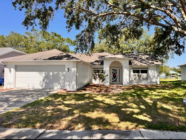 7342 Skyview Ave, New Port Richey, FL 34653 - single story home featuring an attached garage, driveway, a front lawn, roof with shingles, and stucco siding