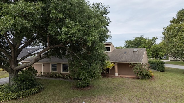 6047 Shore Line Dr, Orlando, FL 32819 - view of front facade with a front lawn and stucco siding