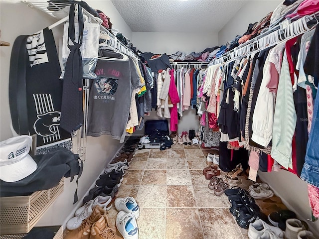 6047 Shore Line Dr, Orlando, FL 32819 - spacious closet with stone finish flooring