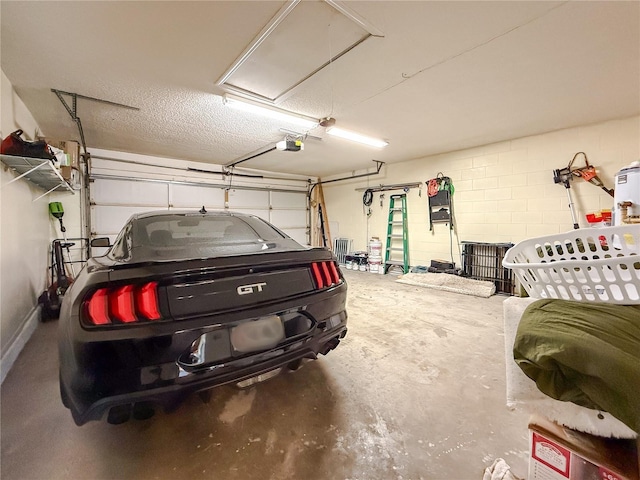 6047 Shore Line Dr, Orlando, FL 32819 - garage with a garage door opener and concrete block wall