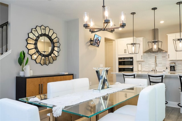12259 Bracco St, Winter Garden, FL 34787 - dining area with a chandelier, light wood finished floors, and recessed lighting