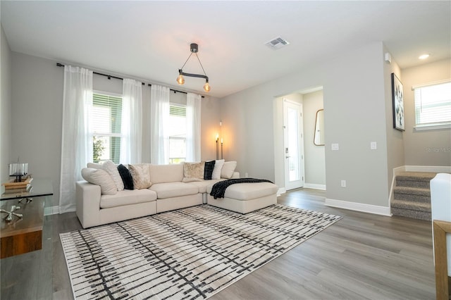 12259 Bracco St, Winter Garden, FL 34787 - living room featuring wood finished floors, stairway, baseboards, and recessed lighting