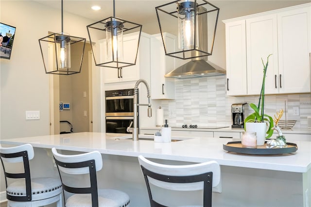 12259 Bracco St, Winter Garden, FL 34787 - kitchen featuring double wall oven, decorative backsplash, white cabinetry, and recessed lighting