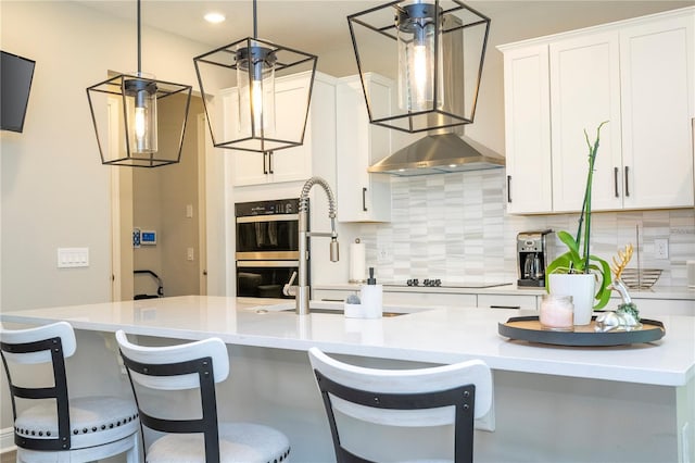 12259 Bracco St, Winter Garden, FL 34787 - kitchen with black appliances, tasteful backsplash, white cabinets, and recessed lighting
