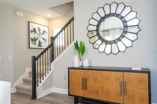12259 Bracco St, Winter Garden, FL 34787 - stairs featuring wood finished floors, baseboards, and recessed lighting