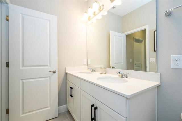12259 Bracco St, Winter Garden, FL 34787 - full bathroom with double vanity, tile patterned flooring, and baseboards