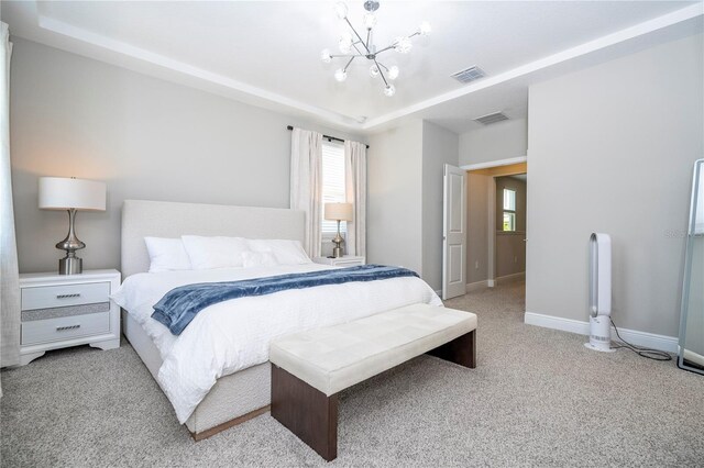 12259 Bracco St, Winter Garden, FL 34787 - carpeted bedroom with a chandelier, multiple windows, a tray ceiling, and baseboards