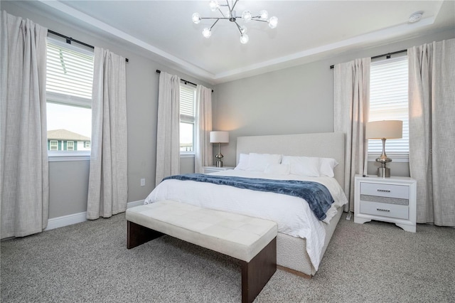 12259 Bracco St, Winter Garden, FL 34787 - carpeted bedroom with a chandelier, multiple windows, and baseboards